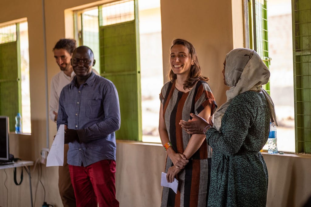 From left to right: Julien Ayroles, Echwa John, Sarah LeBaron von Baeyer, and Hiba Babiker discussing benefit sharing for the study with community leaders.