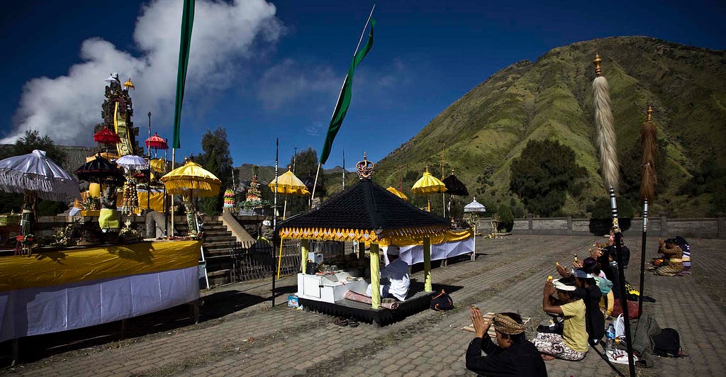 Hindu worshippers pray at a temple at the foot of Mount Bromo during the Yadnya Kasada Festival. (Ulet Ifansasti/Getty Images)