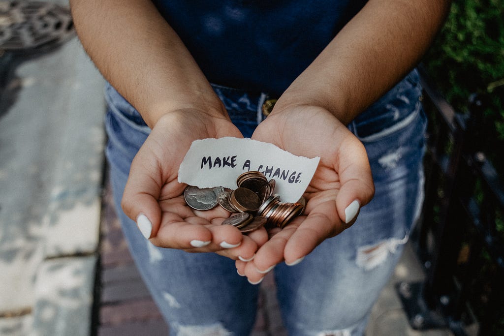 Person holding coins in both hands