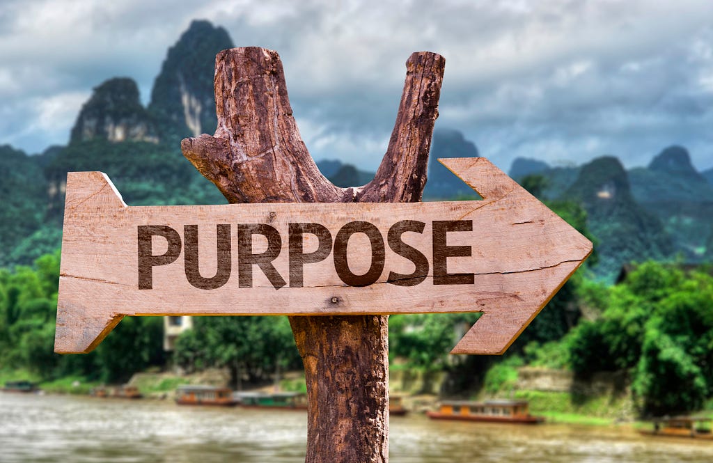 Purpose on wooden sign board. What is your life purpose?