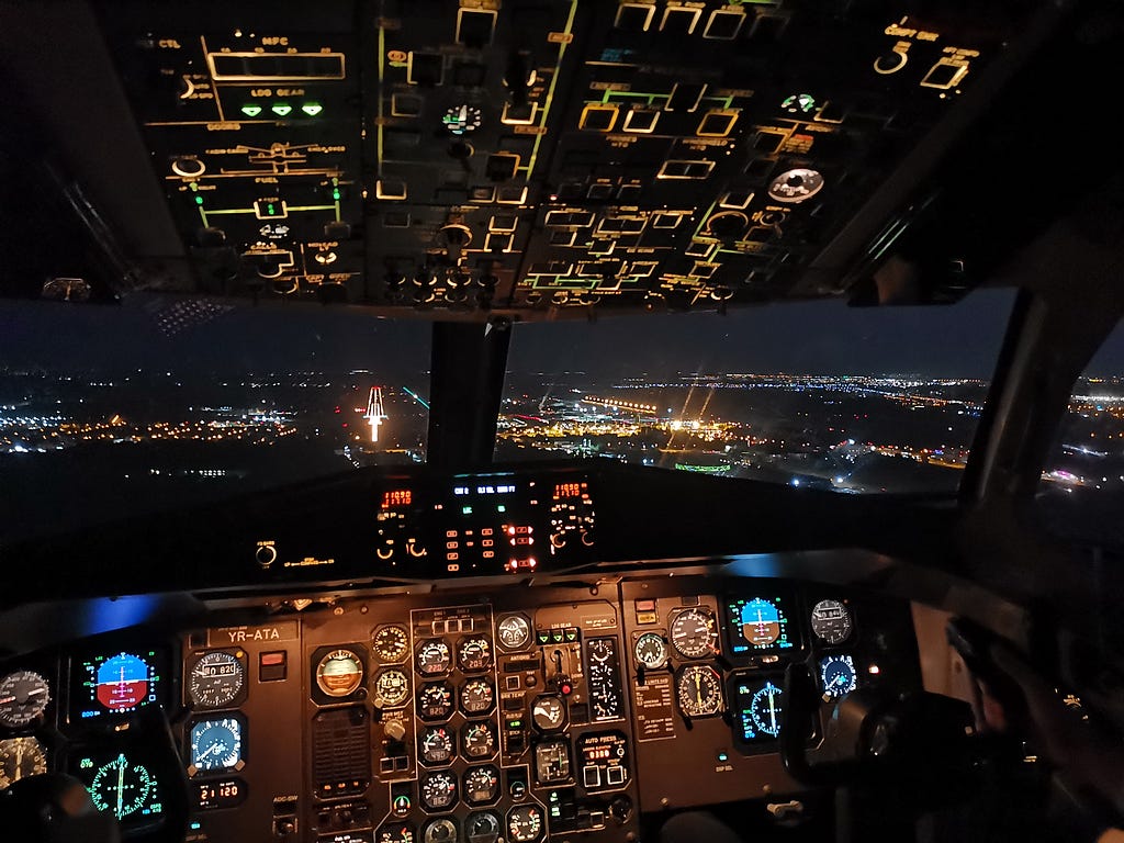 A very detailed aircraft interface, lit up, at night