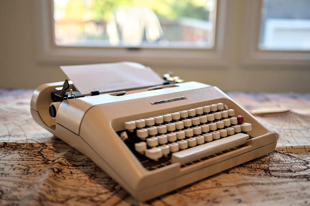 Olivetti Lettera 35 typewriter on old world map