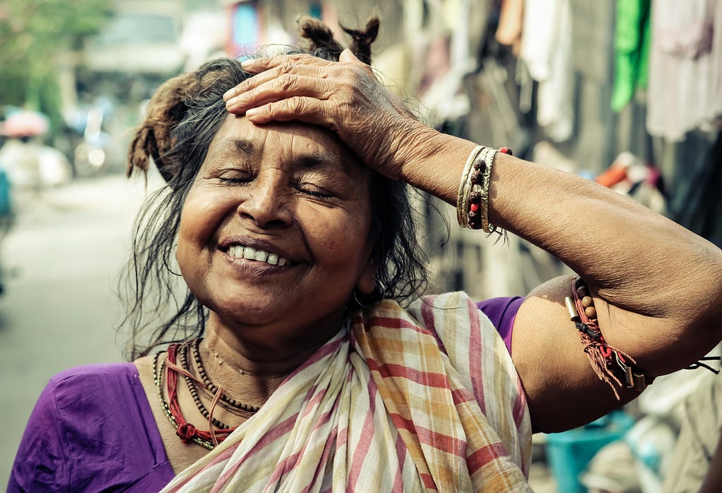 woman with her hand on head