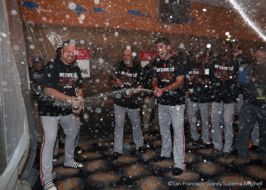 The team celebrates in the clubhouse.