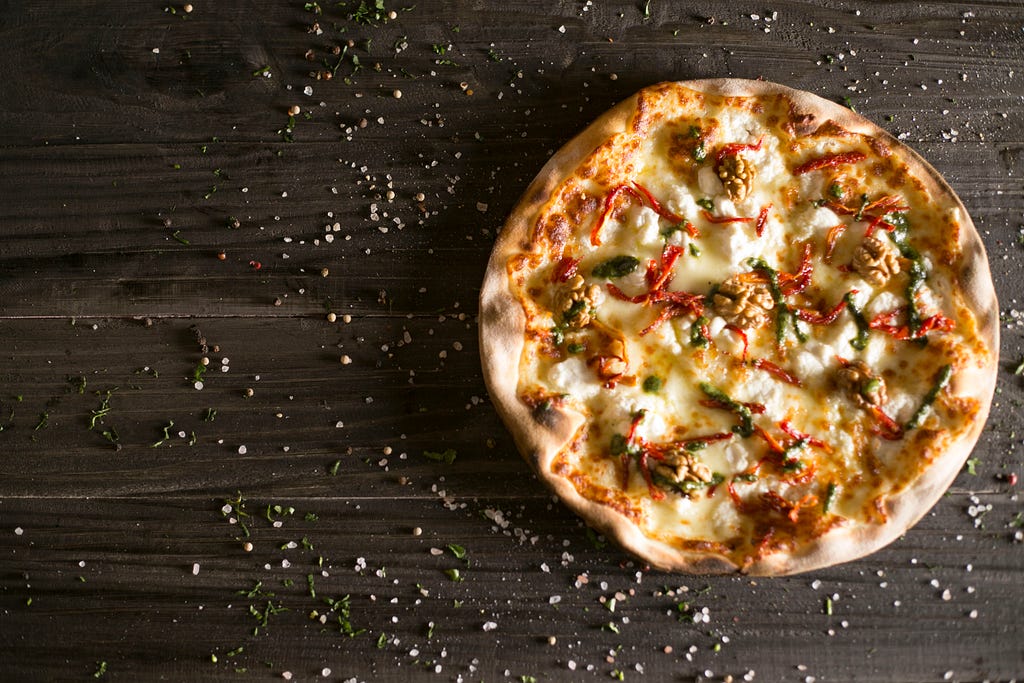 photo of pizza on a cutting board