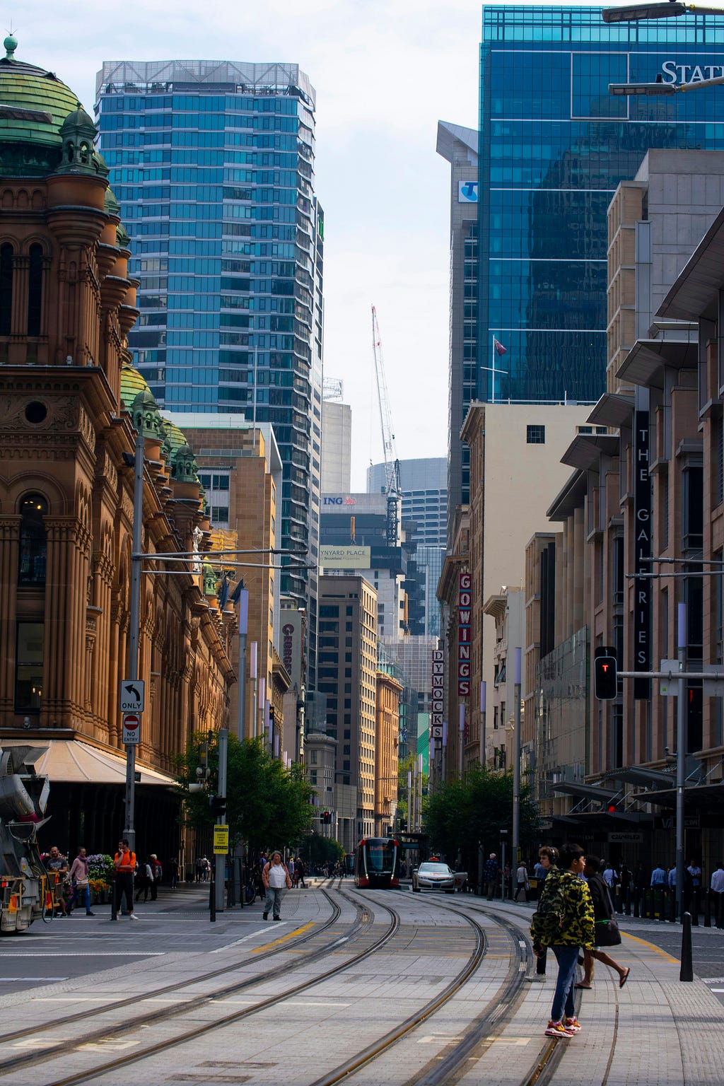 View of tram tracks near the QVB on Sydney’s George Street, surrounded by high rise buildings