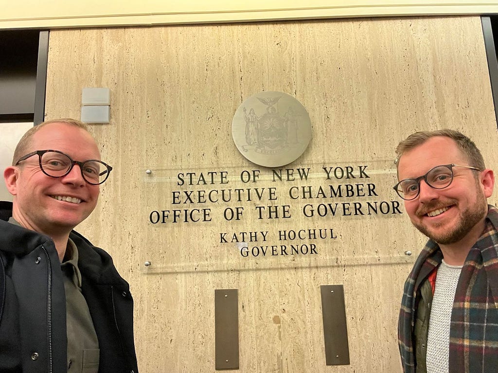 A photo of Chris Fleming and Matt Harrington at the offices of New York Governor Kathy Hochul.