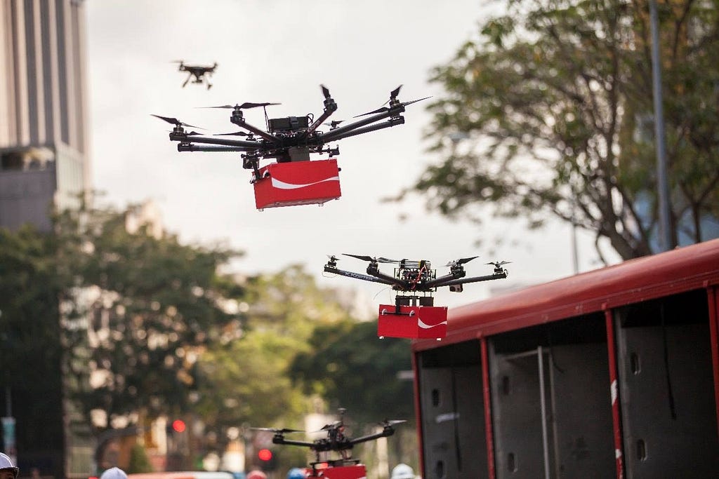 Drones deliver boxes with some goods across the city