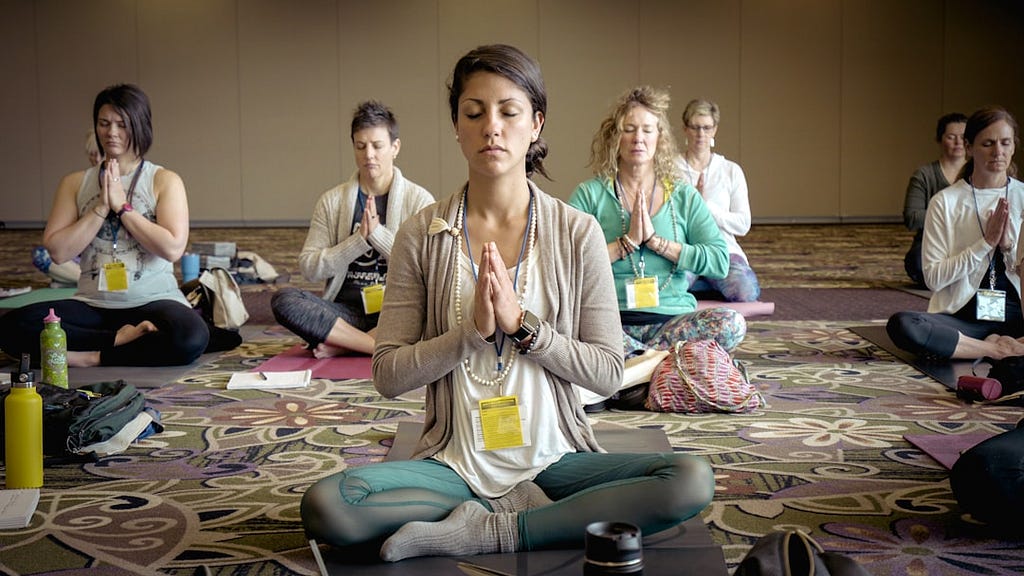 A class of women meditating