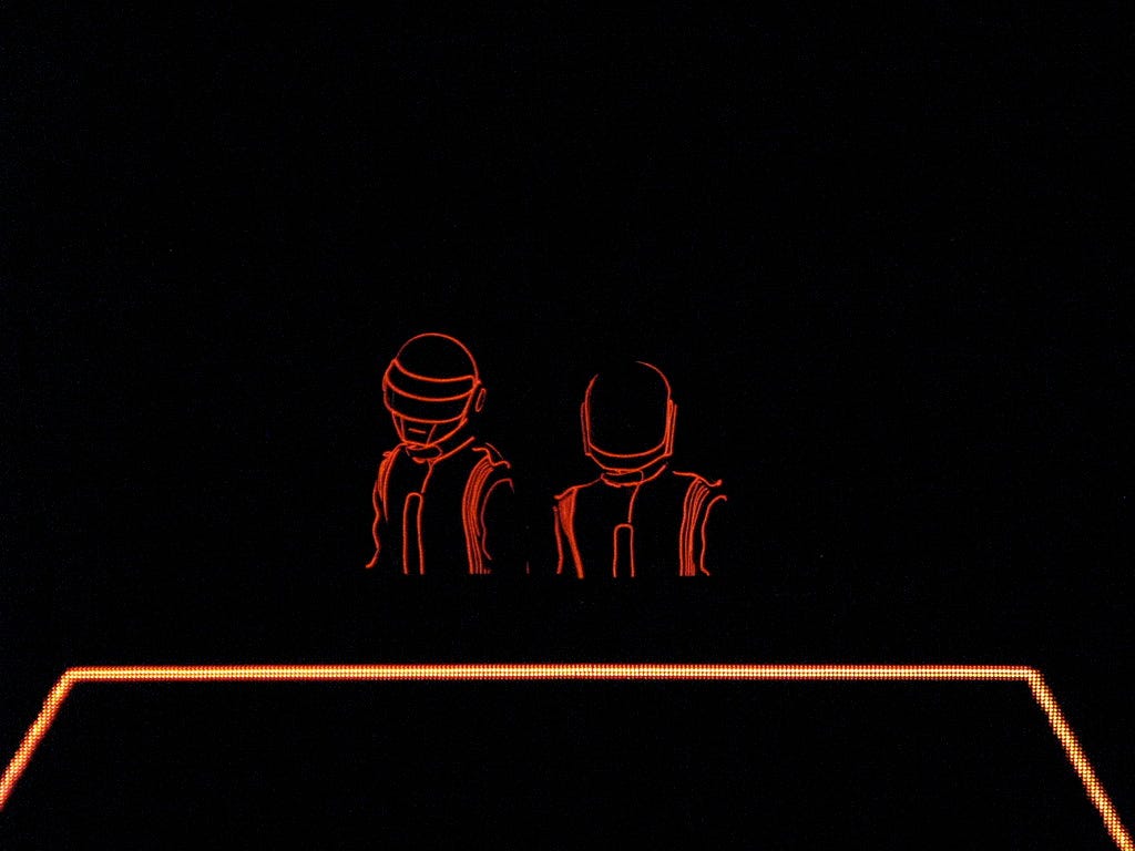 The closing scene from Daft Punk’s performance at Sydney’s NeverEverLand event, two robot outlines in red against a black background