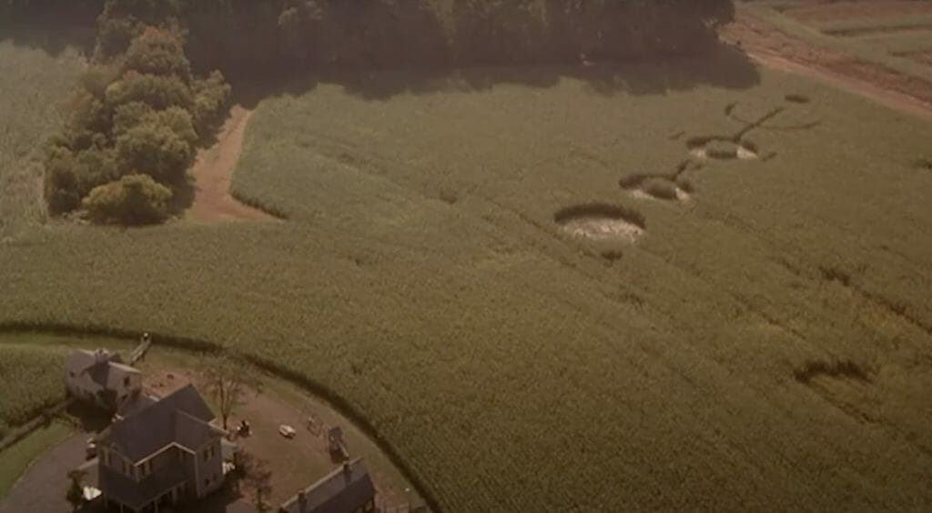 Aerial view of the Hess farmhouse, with three alien crop circles on the side.