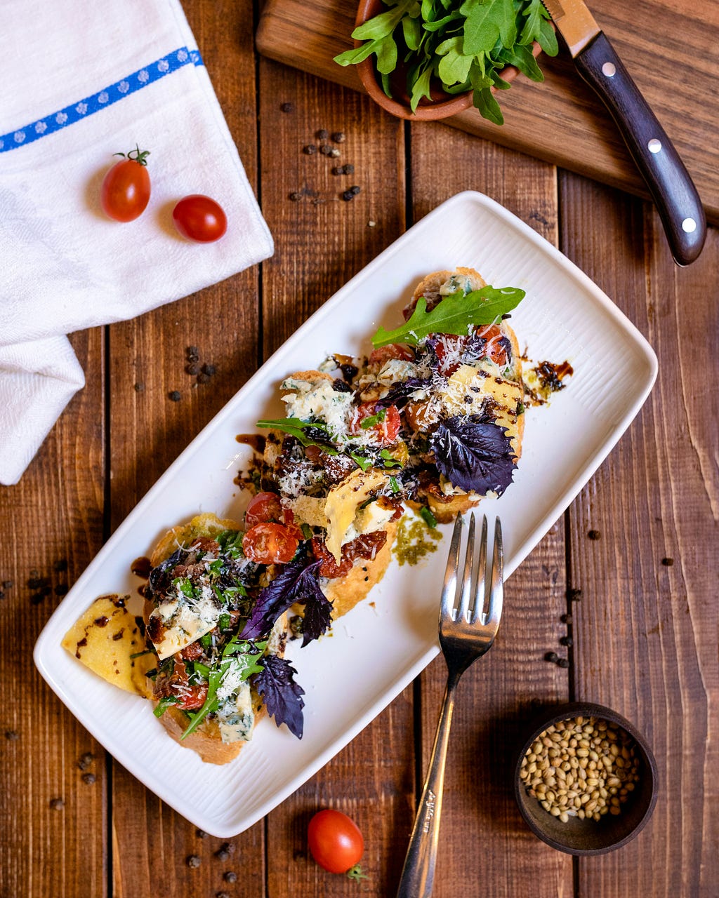 Various healthy foods, on top of wooden cutting board.