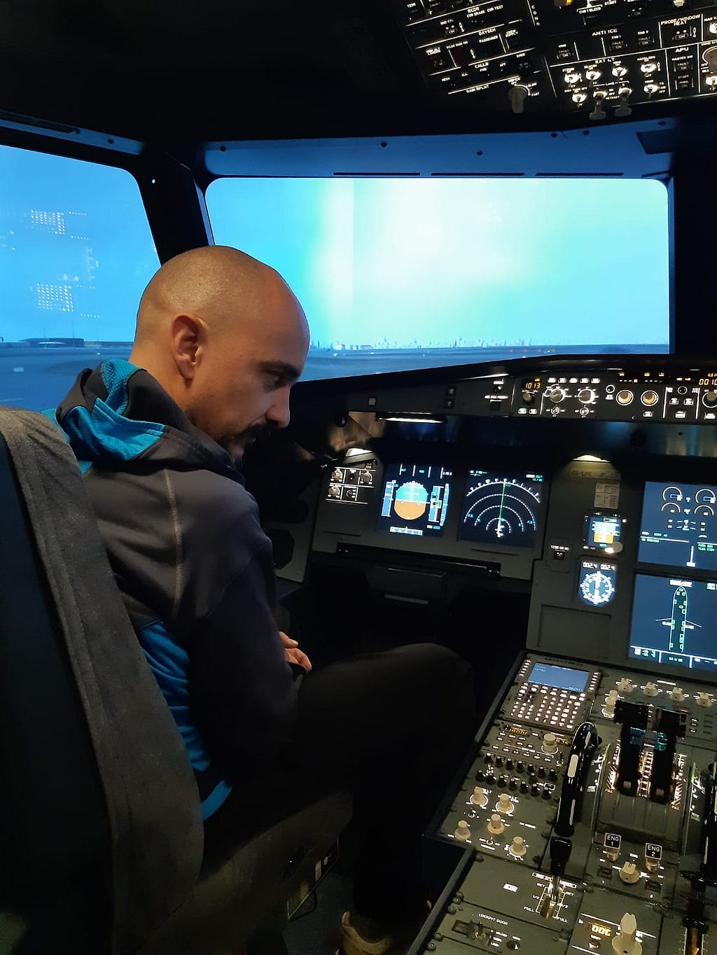 The author, trying to make sense of an Airbus A320 flight deck.