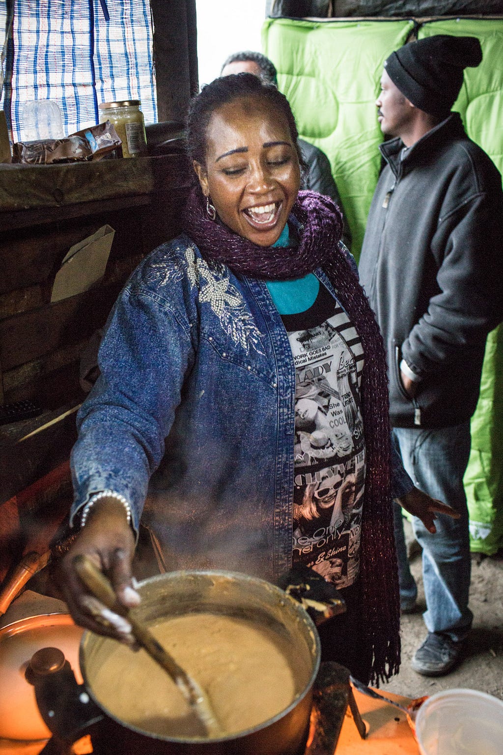 Rasha prepares mullah robe, or yogurt stew, for her neighbors. According to custom, it is eaten with the hand.