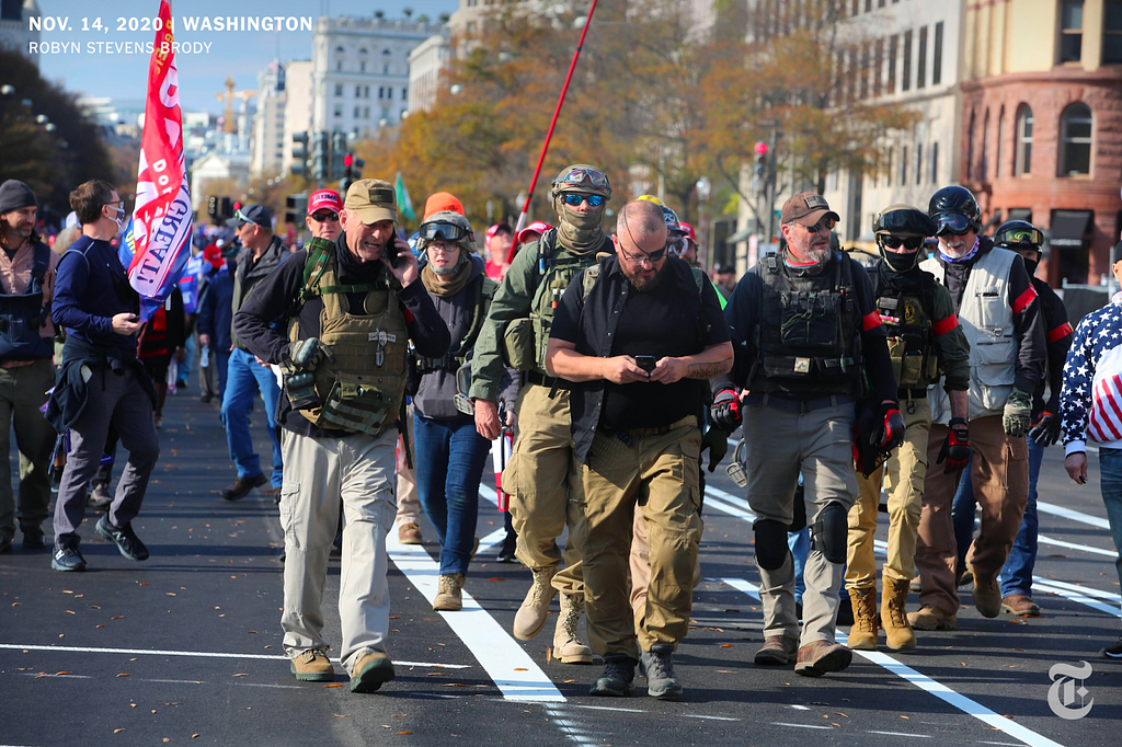 Around nine Oath Keepers marching in the street during the Million MAGA March on November 14, 2020