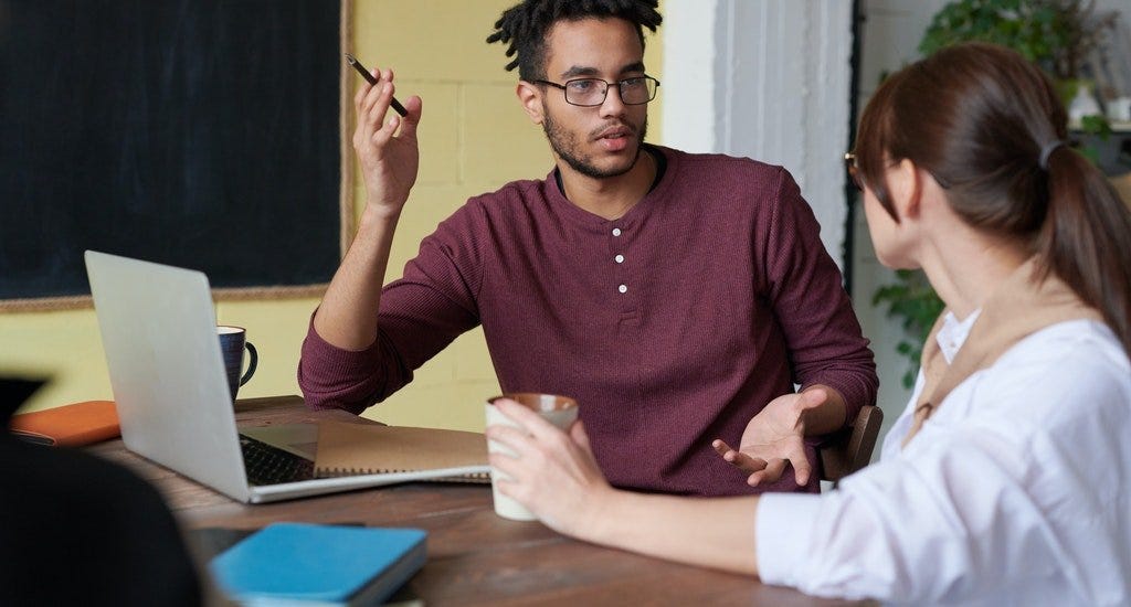 A man and woman having a business discussion