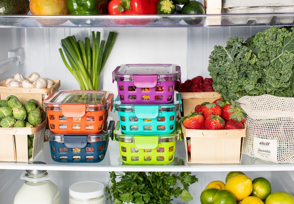 Organized fridge with colorful fruits and vegetables