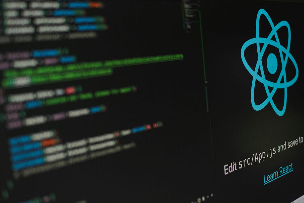 An image of a code editor with the React logo.