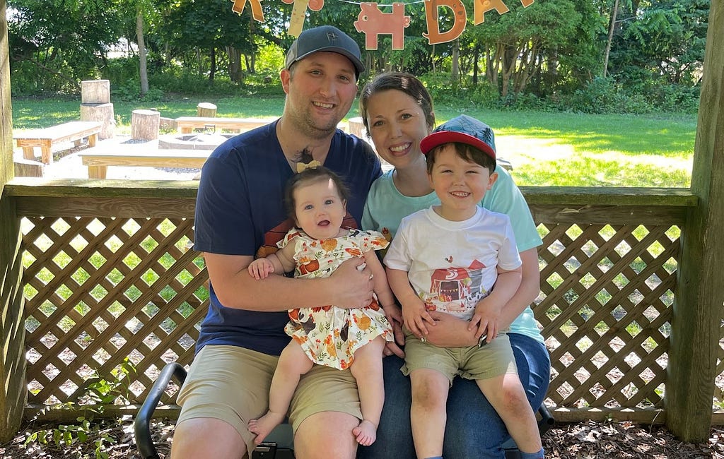 Family smiling together outside