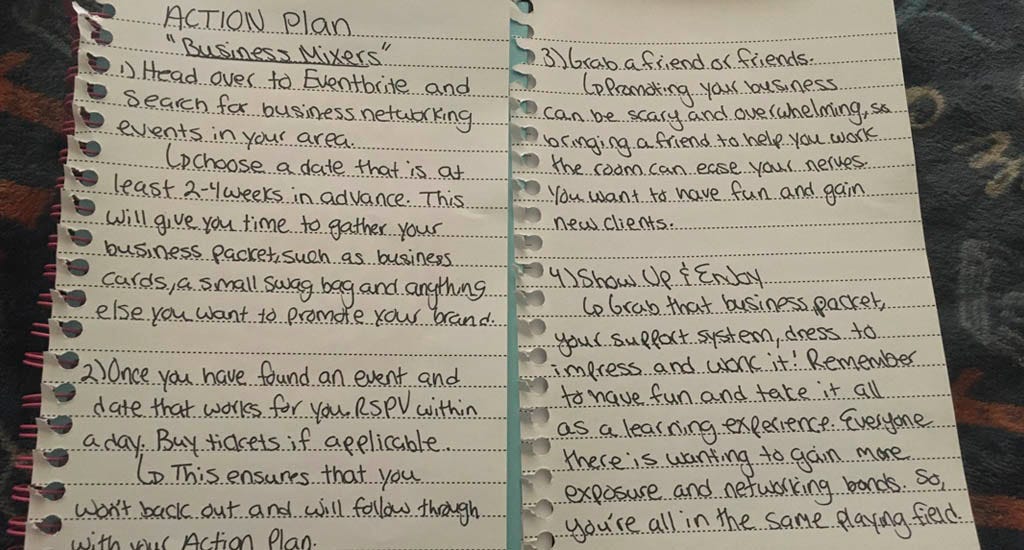 Action plan for a business mixer written in a notebook