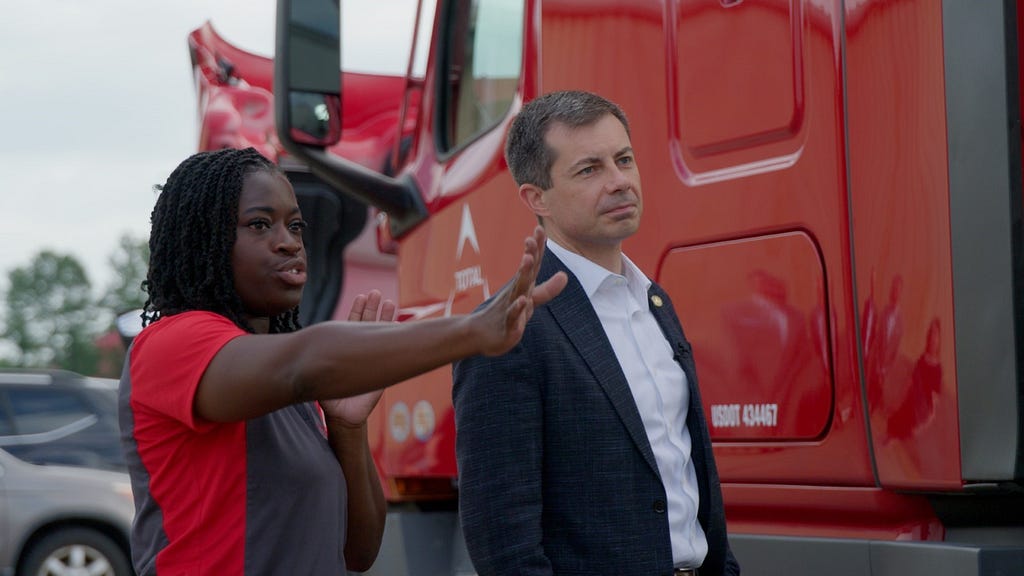 Secretary Buttigieg hears about truck inspections from a driver at Total Transportation