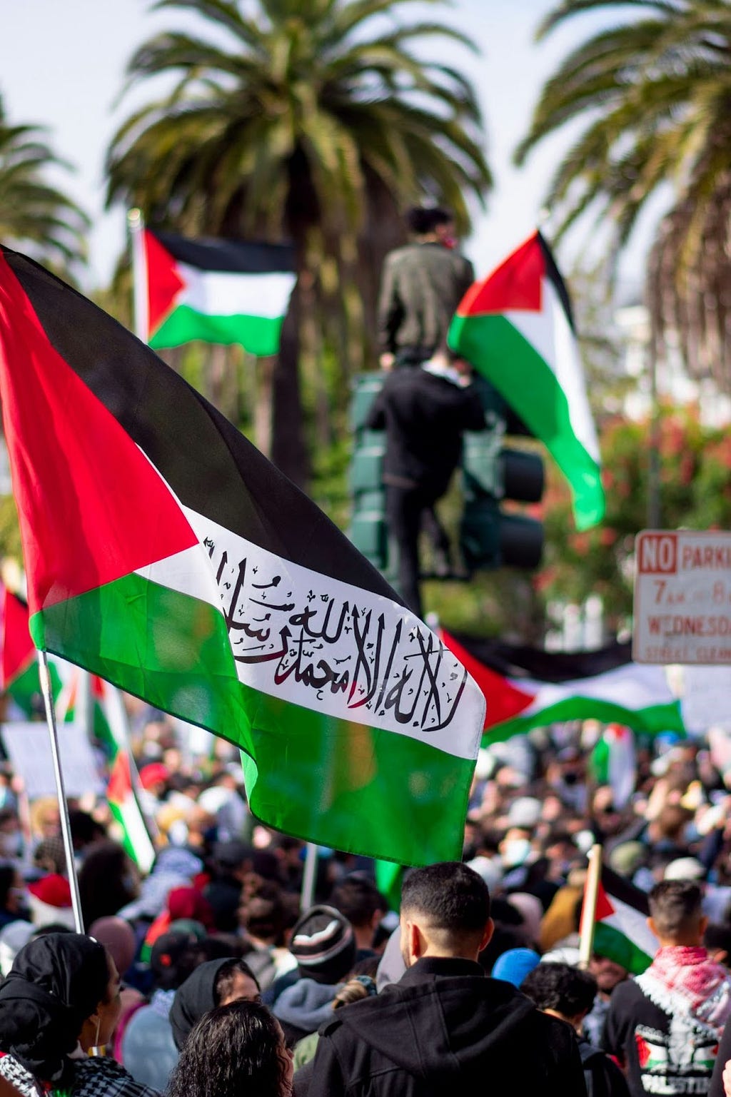 people holding flags during daytime. Protest against Israel & US aid to Israel and for a free Palestine on May 15th, San Francisco CA, 2021