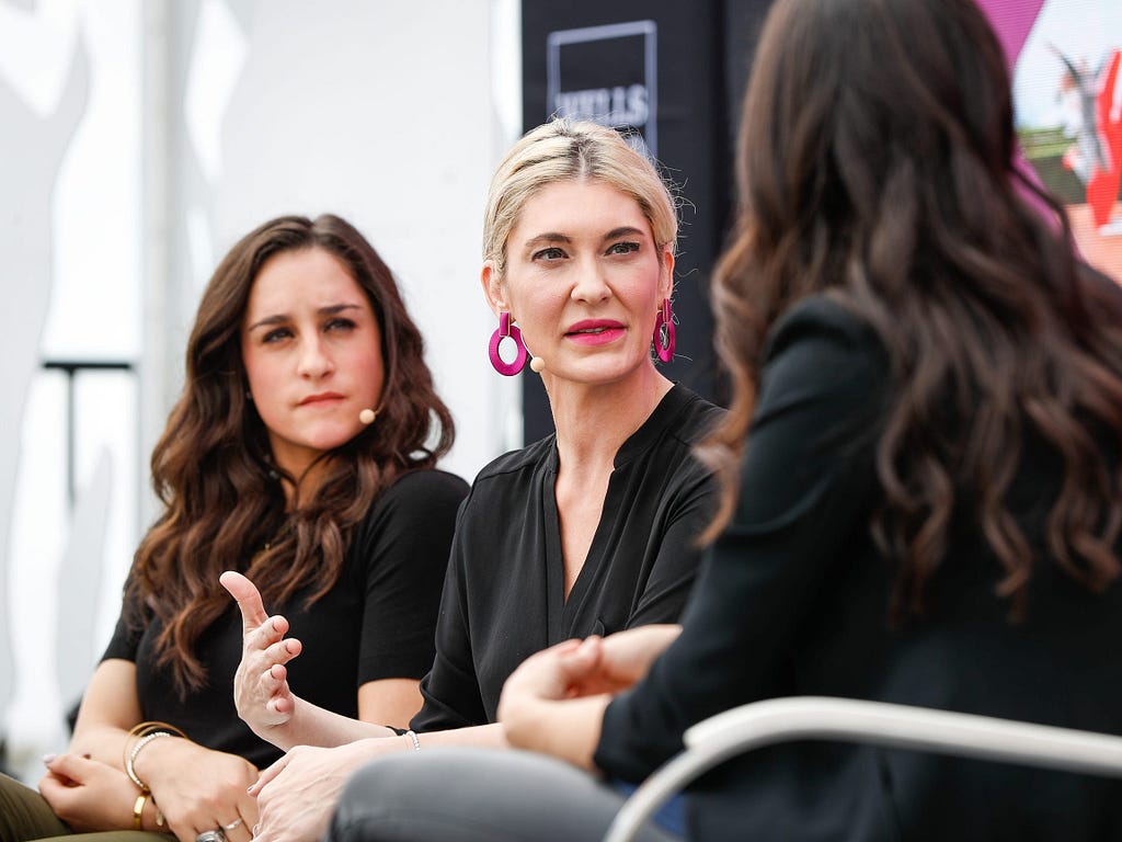 Jordyn Wieber and Sarah Klein (center) speaking at the espnW Summit in 2018.