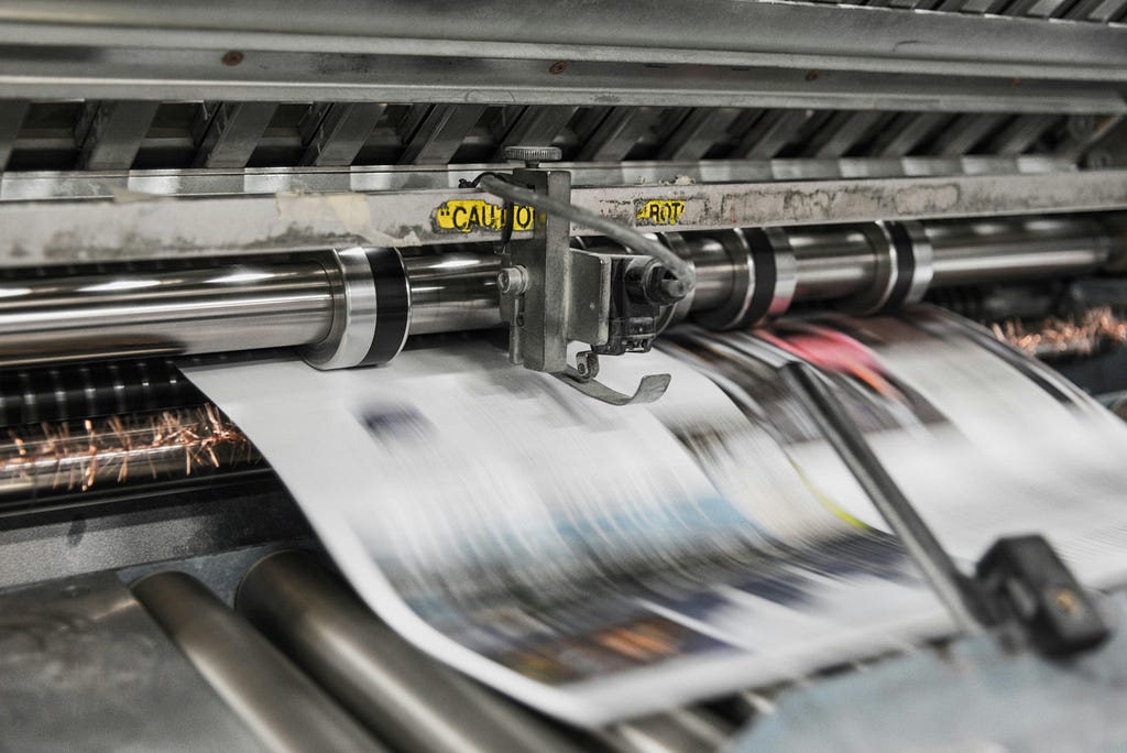 Newspapers being printed on reels