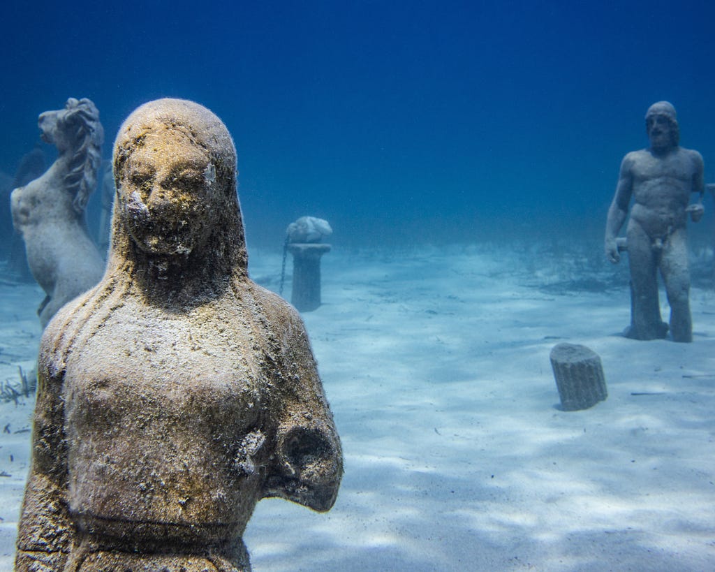 Classical statues in the ocean