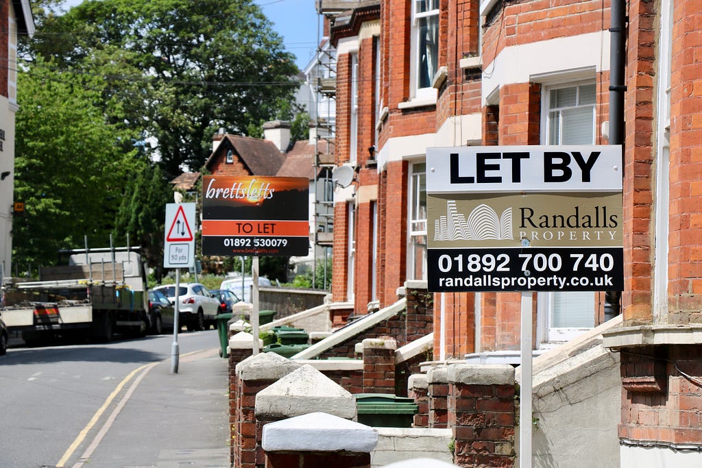 Houses with to let signs outside