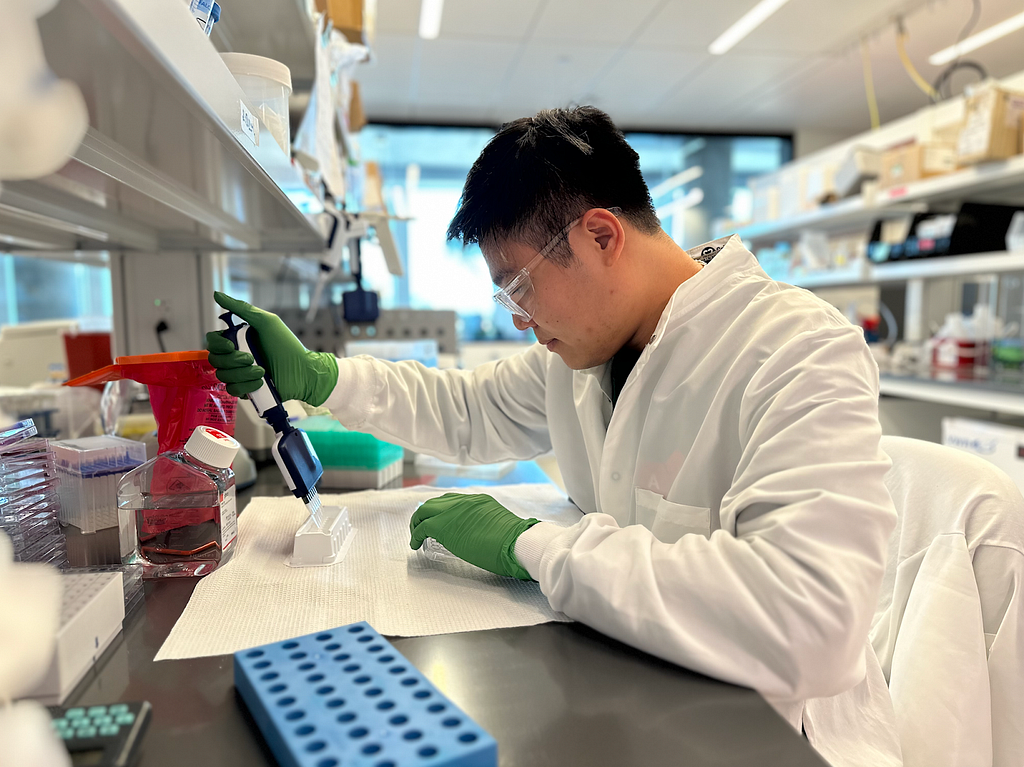 Luan Phan, Associate Scientist at Variant Bio, working in the lab.