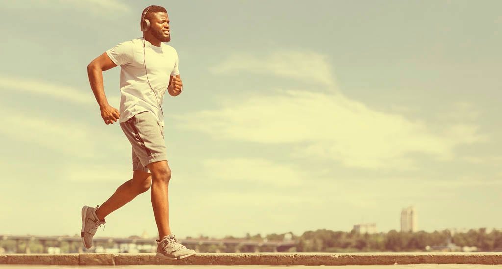 Entrepreneur jogging near river in early morning