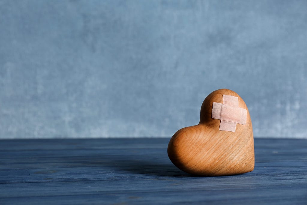 Bandaged heart made of wood