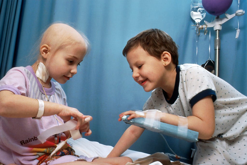 Two children undergoing chemotherapy at a hospital