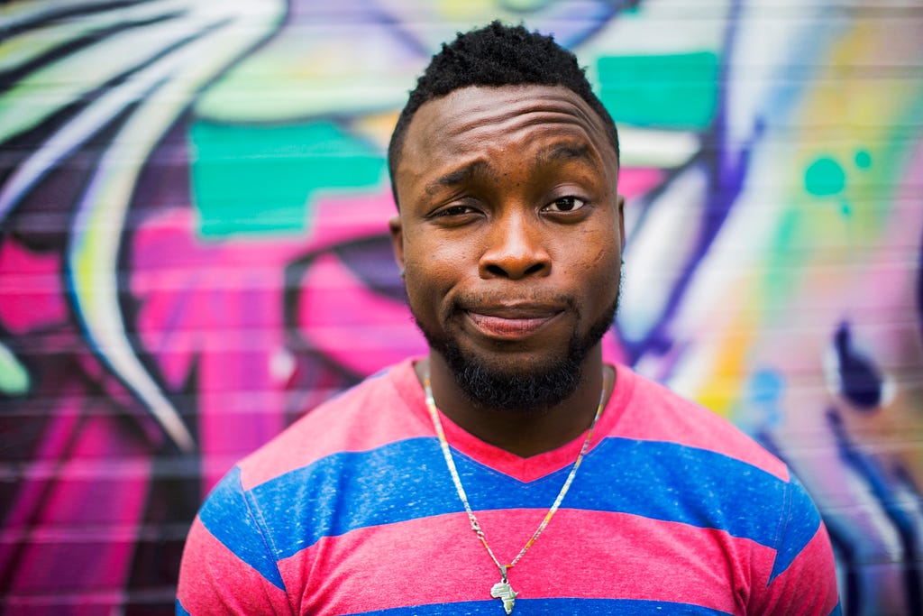 a person raising his eyebrow looking at the camera.