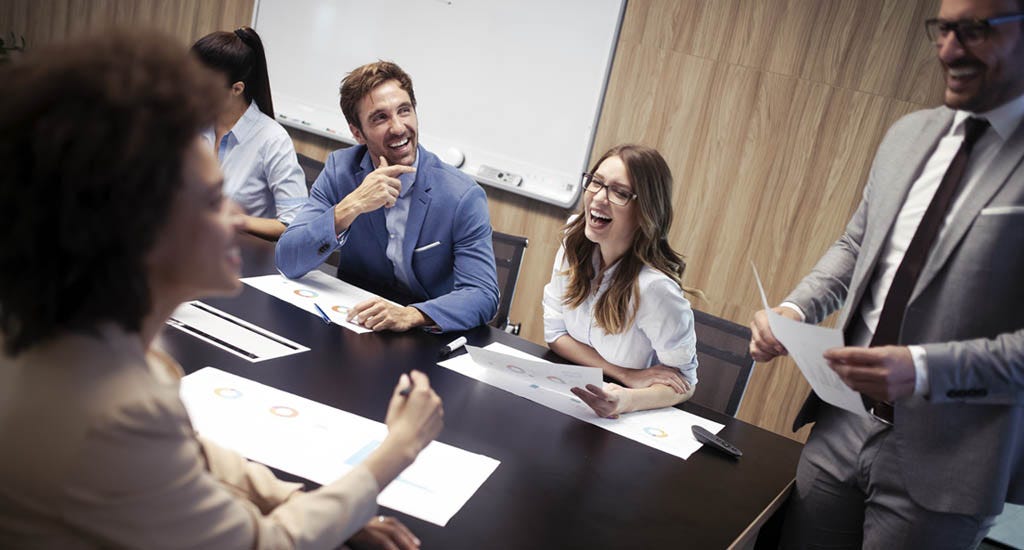 Manager leading squad members in group discussion