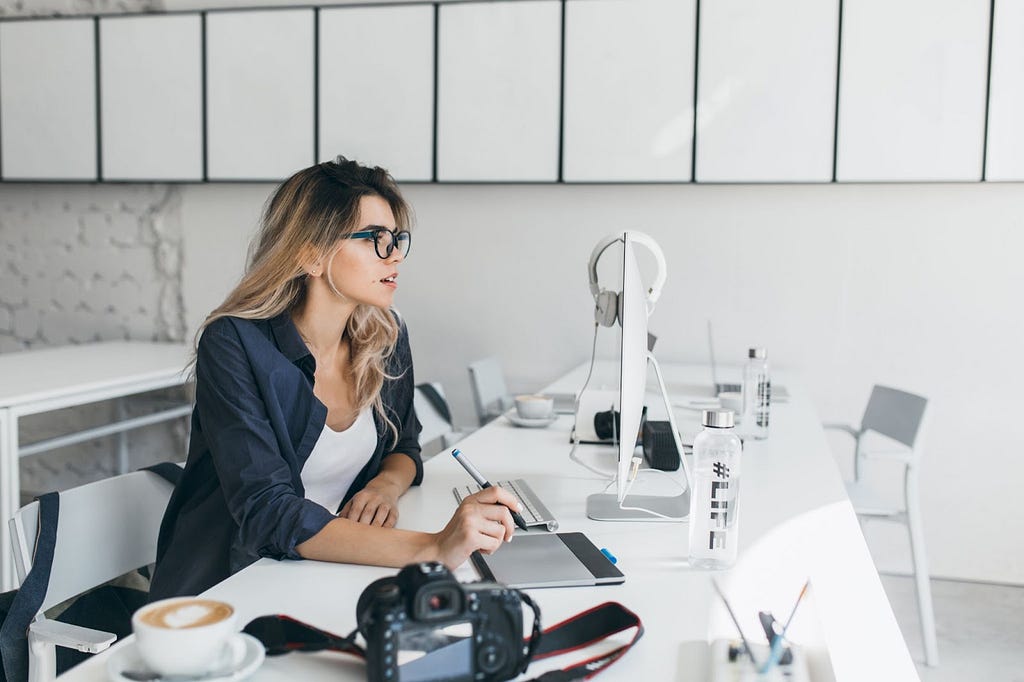 designer female working in front of computer