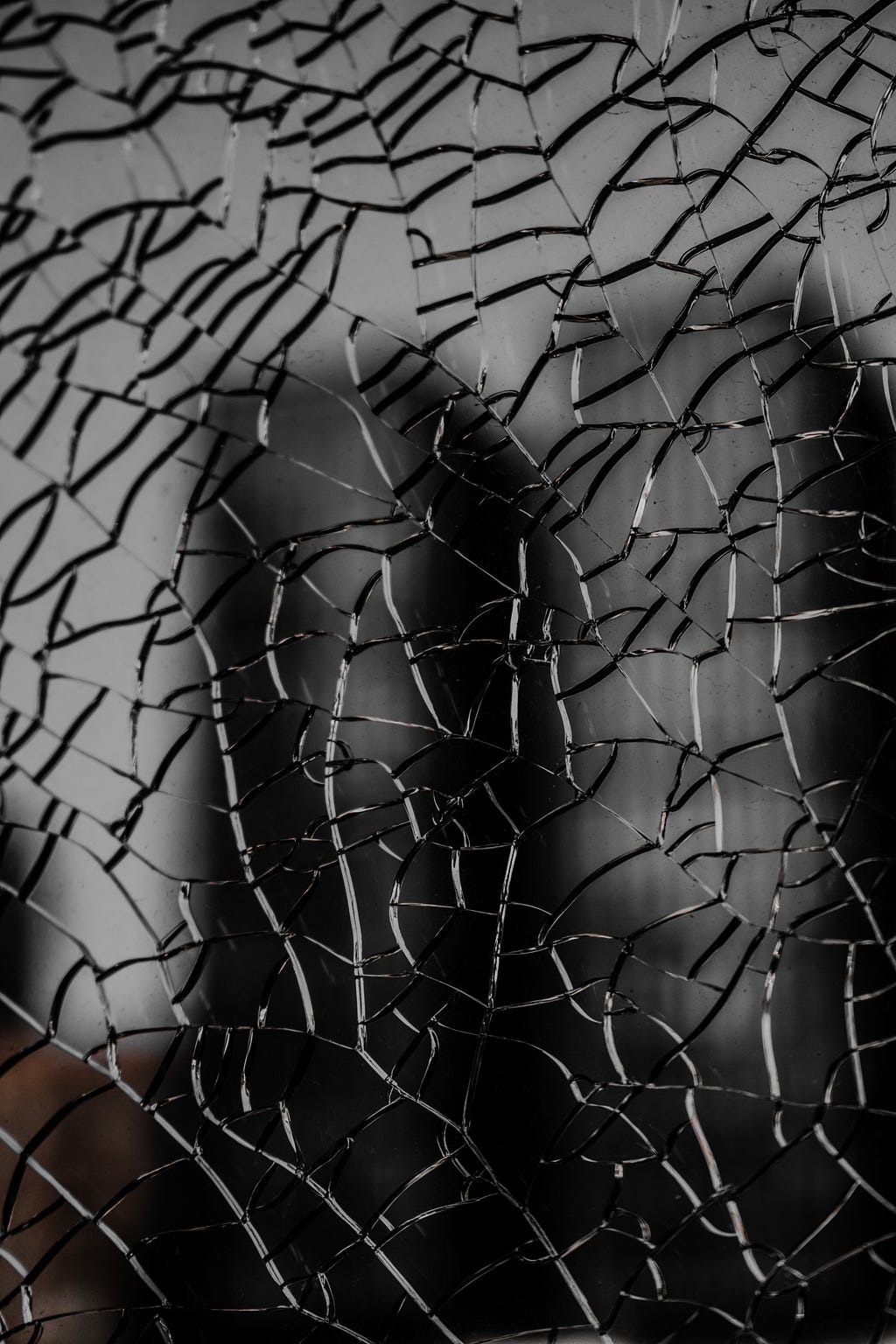 Image of a broken mirror with multiple cracks
