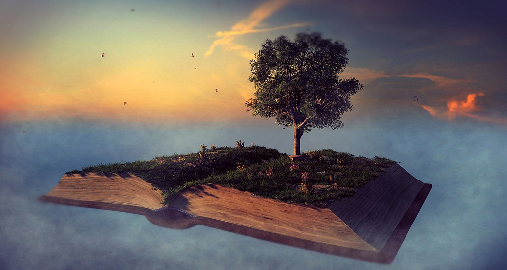 A large book sits open against the sky, with grass and a tree growing out of it