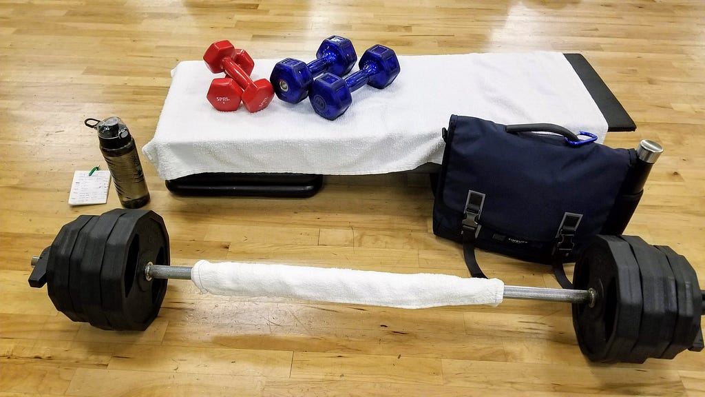 Photo of dumbbells and a barbell.