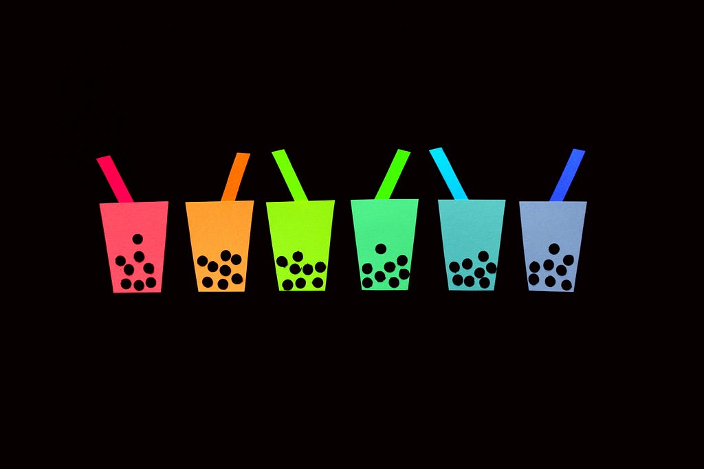 illustrated art of several boba cups in a spectrum of rainbow hues