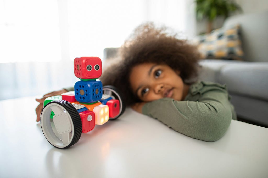 kid playing with toy without showing interest