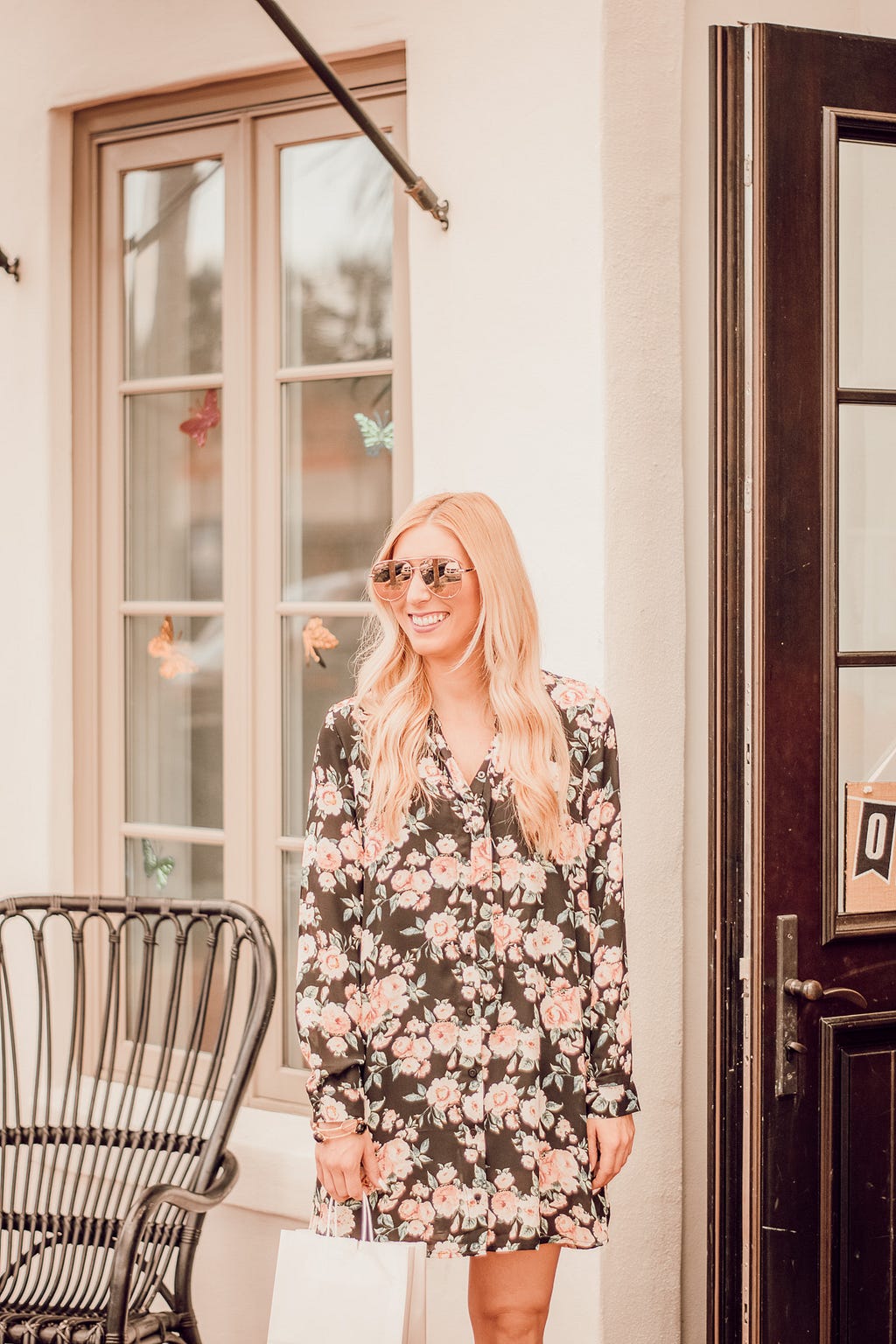 smiling blonde woman wearing sunglasses