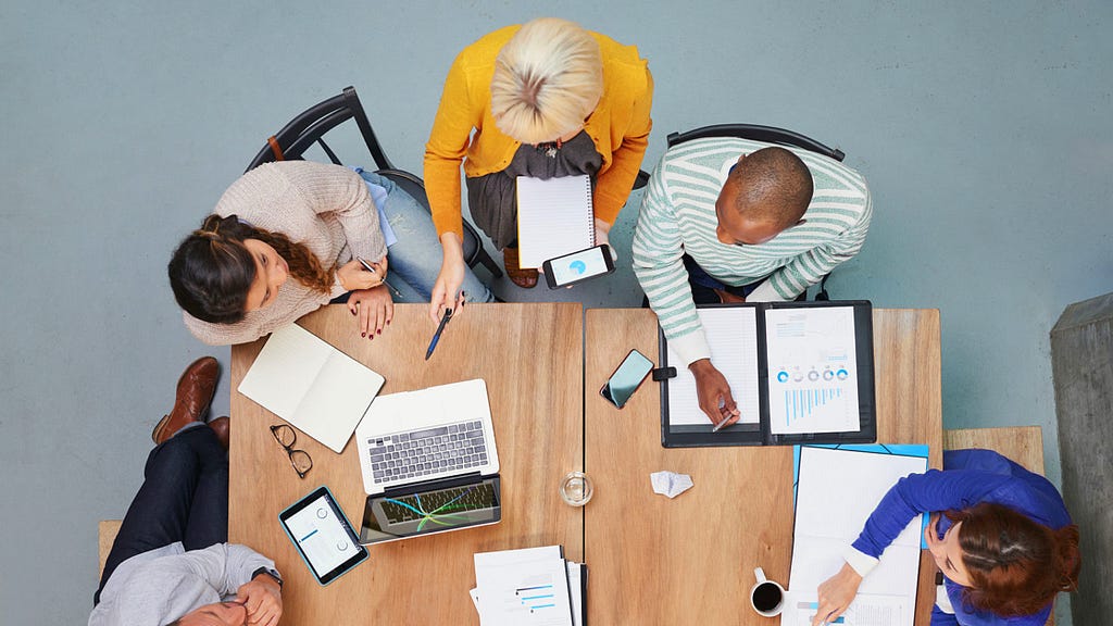 Image of a group of people sitting around a table