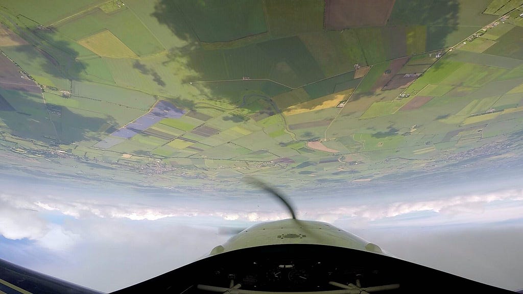 Flying Inverted Over Green Fields — author’s image