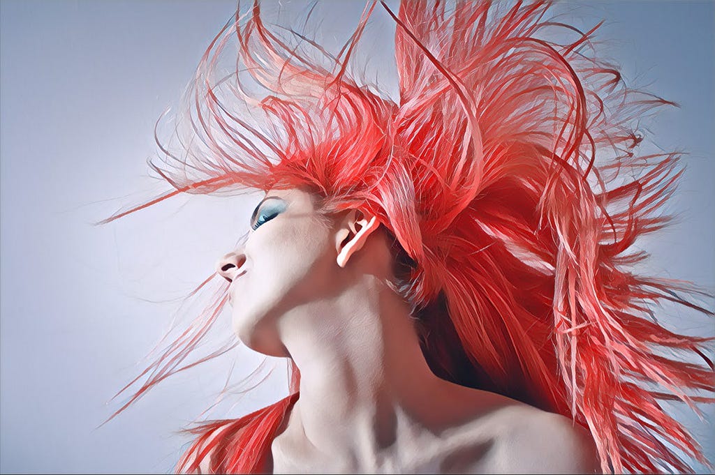 A girl with pink hair shaking her head