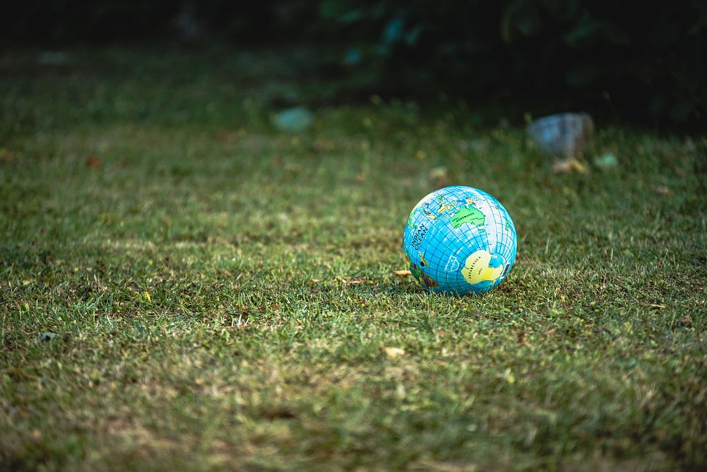 A small globe on the grass