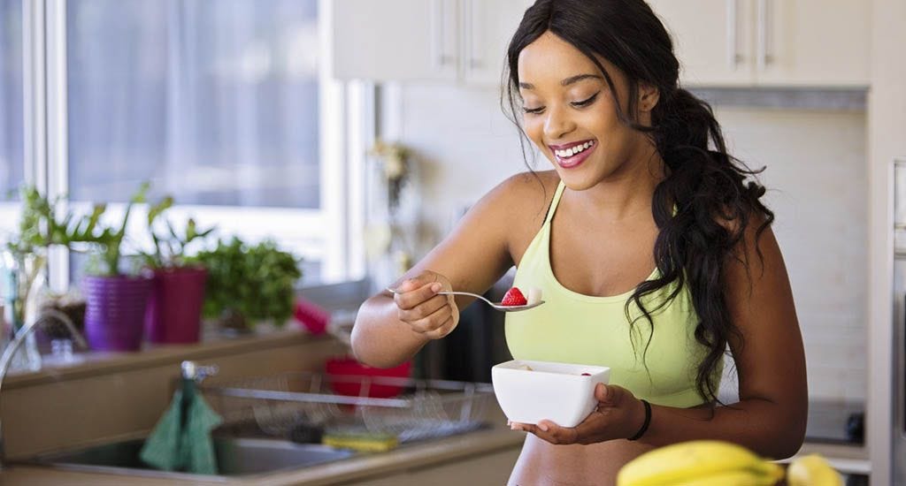 Woman eating healthy while practicing intermittent fasting