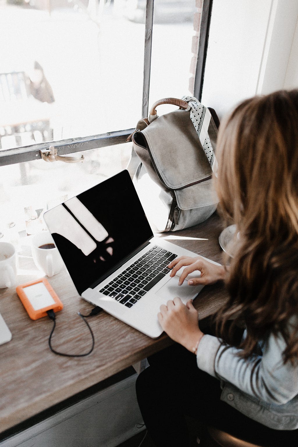 woman typing on a laptop