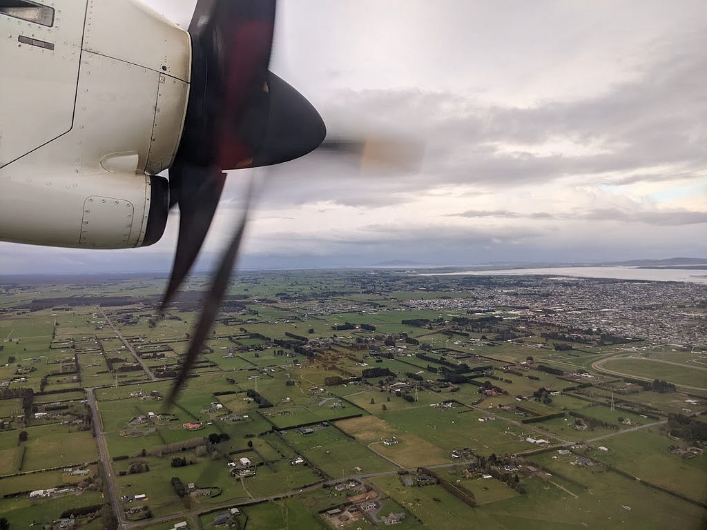 Taken from a plane, the photo shows the farmland of Southland with the city of Invercargill in the distance